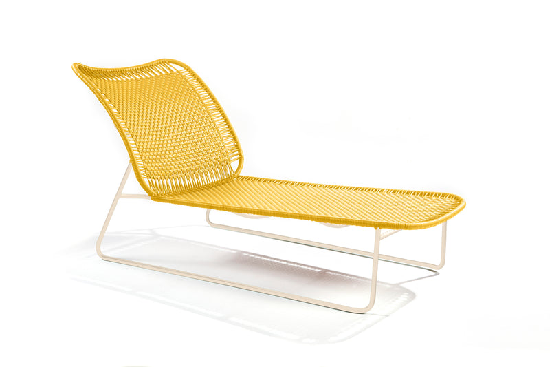 Ames Cielo Daybed by Ames: a modern yellow woven lounge chair with a white metal frame, inspired by Sebastian Herkner’s sleek lines, featuring a curved backrest and seat on a plain white background.