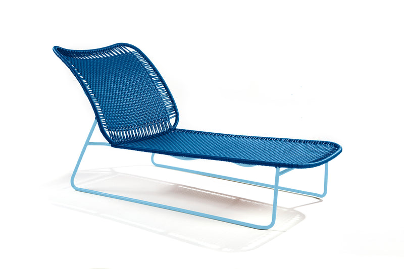 The Ames Cielo Daybed by Ames features a woven seat and backrest on a light blue metal frame, showcasing clean lines and an airy design inspired by Sebastian Herkner's modern aesthetic.