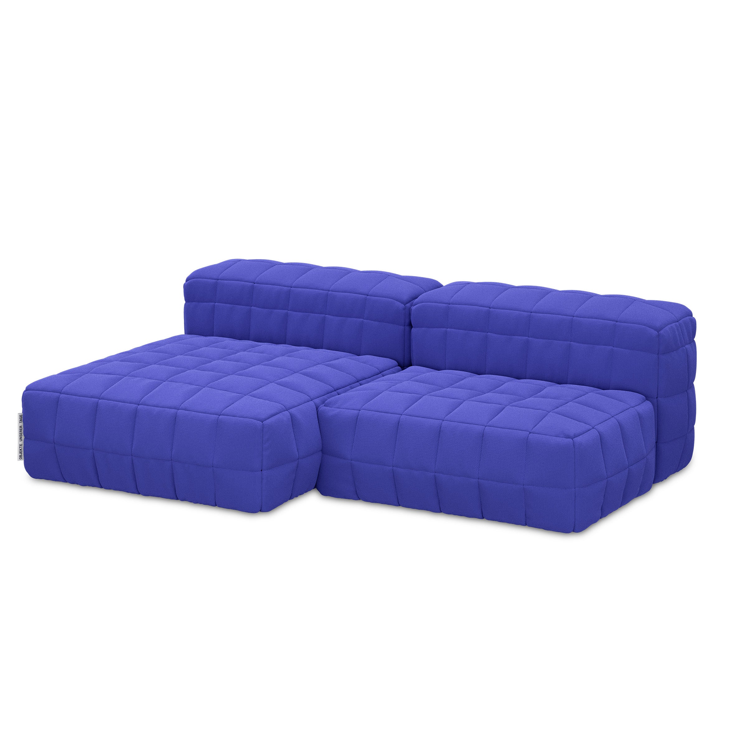 Blue modular Henn Sofa with padded quilted cushions and a modern, playful Tetris-inspired design.