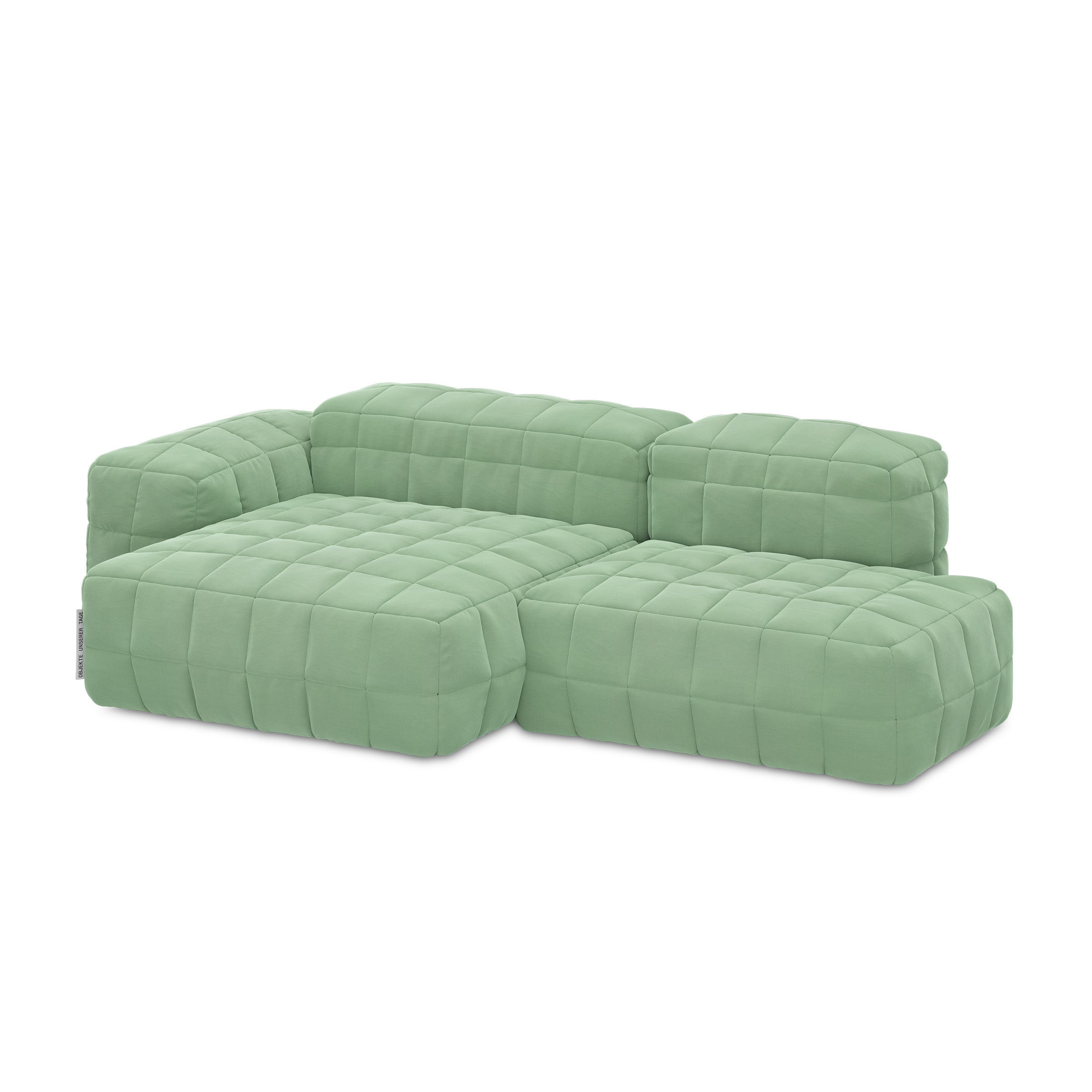 Henn Sofa in light green with modular design, featuring padded cushion covers and distinctive stitched detailing.