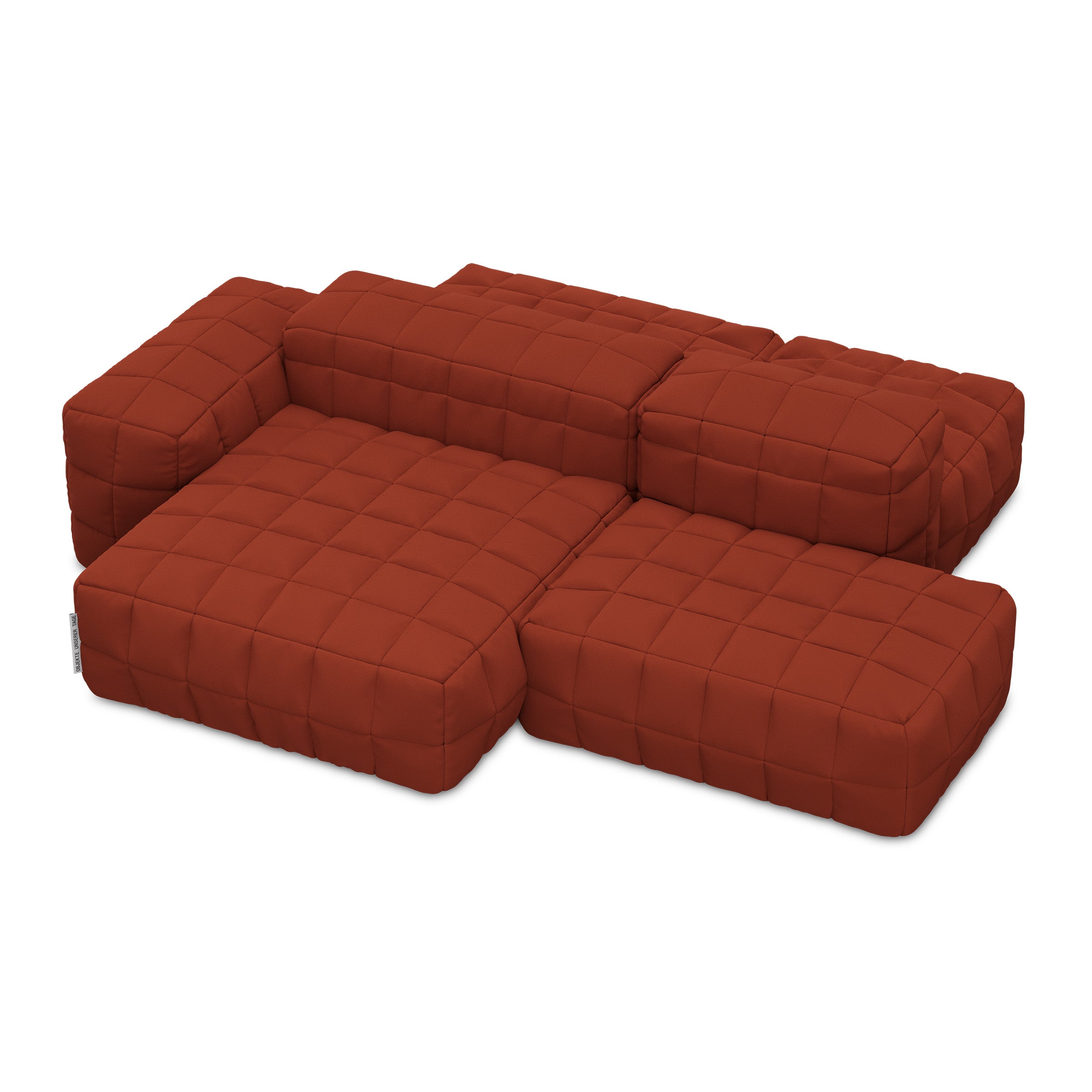 Henn Sofa in modular Tetris-inspired design with padded cushion covers and distinctive stitching in rust color.