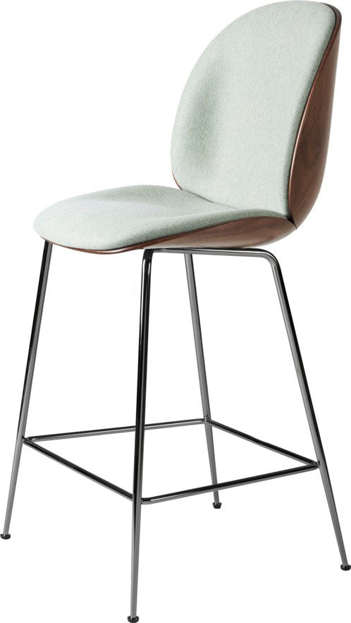 Tall stool with light gray fabric cushioned seat and backrest, wooden shell, supported by slim black metal legs with footrest bar