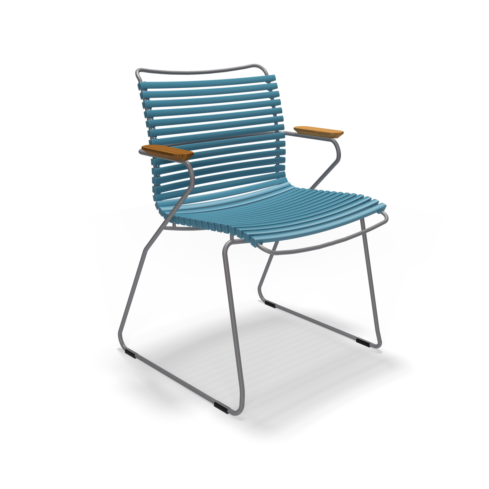 The Click Dining Chair with Armrest by Houe is a stylish, modern outdoor chair featuring weather-resistant blue plastic lamellas for the slatted seat and backrest, complemented by thin metal legs and wooden armrests.