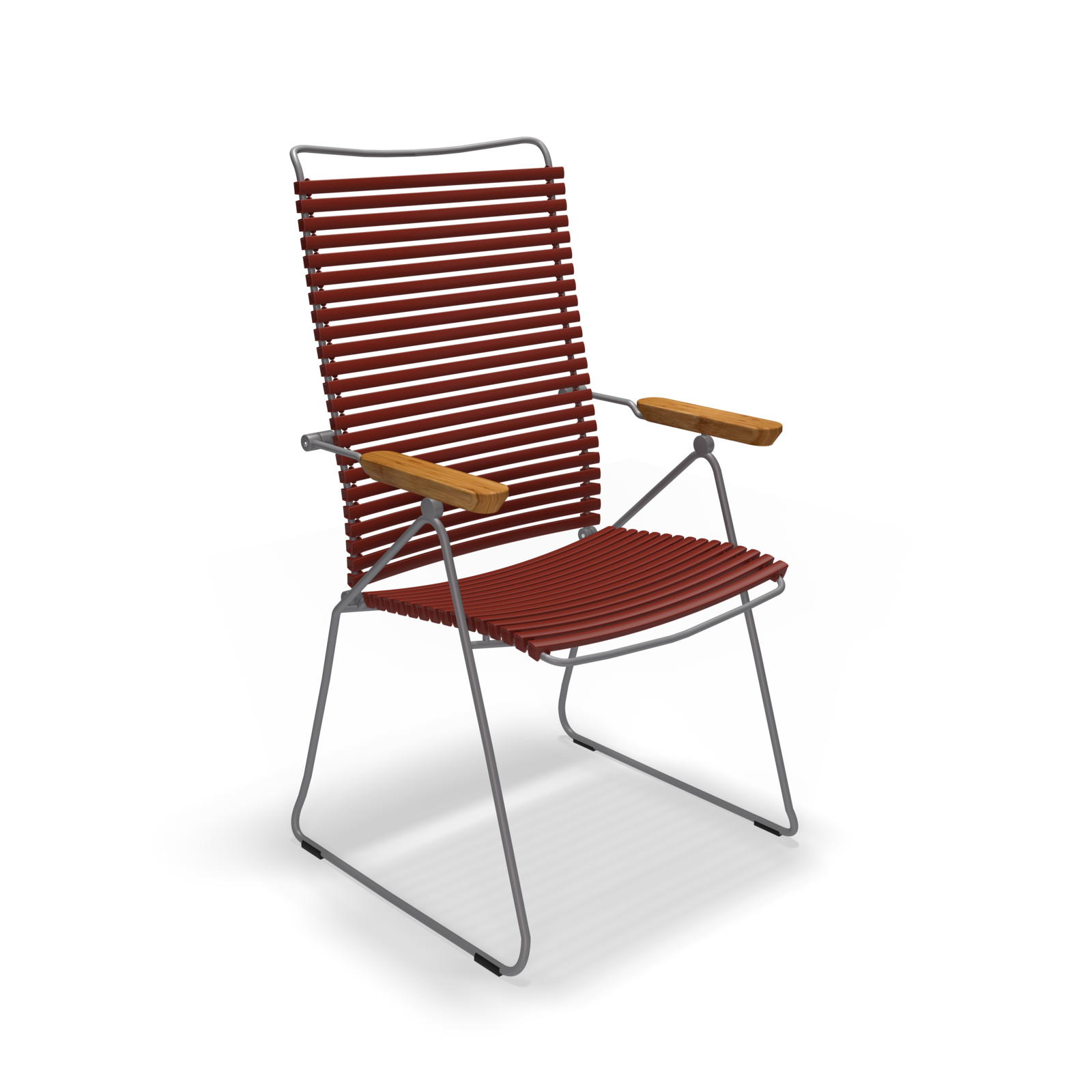 The Click Position Chair by Houe is a modern outdoor chair with a weather-resistant dark metal frame and durable plastic lamellas in horizontal red slats for the seat and backrest. It features wooden armrests, showcasing a minimalist design set against a plain black background.