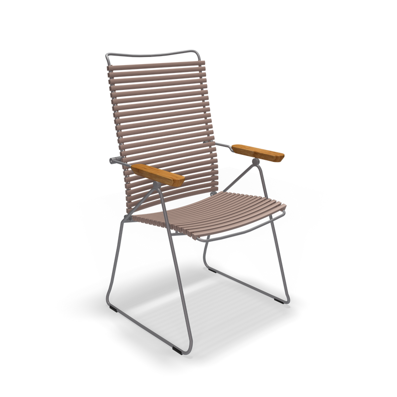 The Click Position Chair by Houe is a modern, minimalist chair with a metal frame and weather-resistant wooden slats for the seat and backrest. Its sleek design, featuring wooden armrests, makes it perfect for both indoor and outdoor settings.