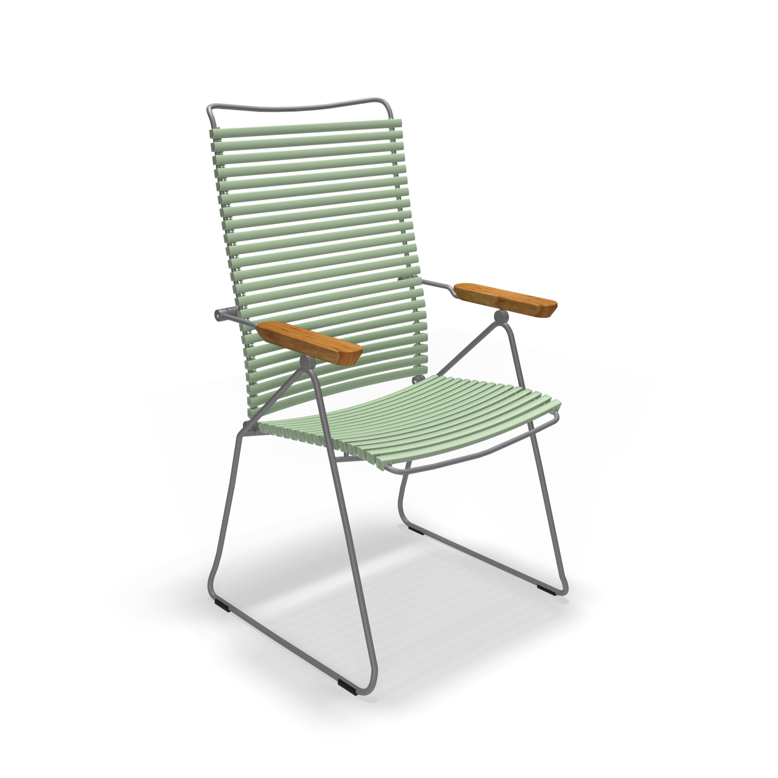 The Click Position Chair by Houe is a modern outdoor chair featuring a metal frame with light green, weather-resistant plastic lamellas on the seat and backrest. Wooden armrests provide a contrasting touch to its sleek, slatted design.