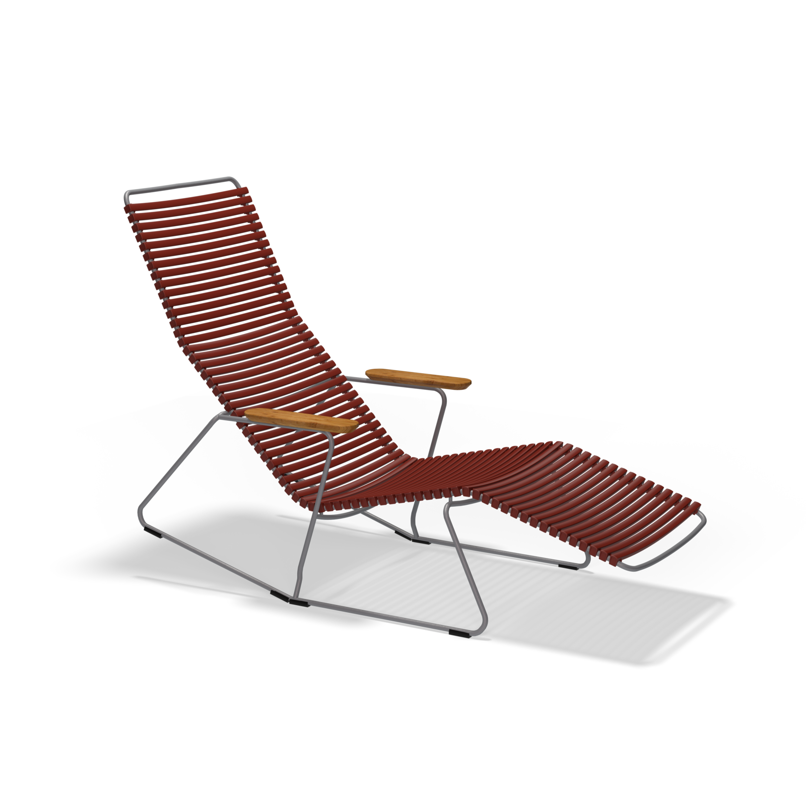 The Click Sunrocker by Houe features a sleek metal frame, reddish-brown woven ribbed seat and backrest, wooden armrests, and an extended footrest. This modern lounge chair is perfect as an outdoor chair and isolated on a black background.