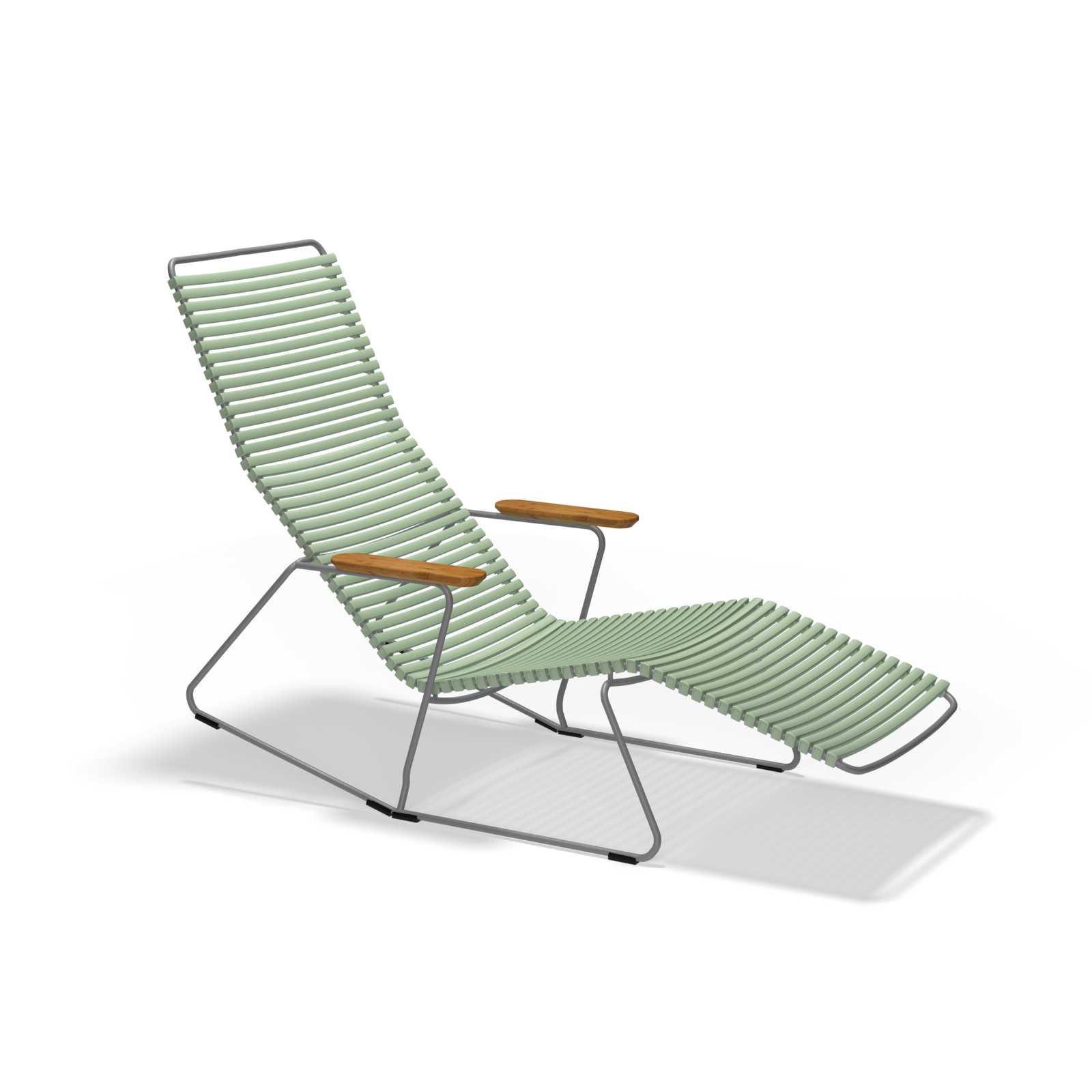 The Houe Click Sunrocker is a modern lounge chair with a sleek black powder-coated steel frame and pale green woven cords for the seat and backrest. Perfect for outdoor use, it features an extended leg rest, wooden armrests, and a minimalistic design.