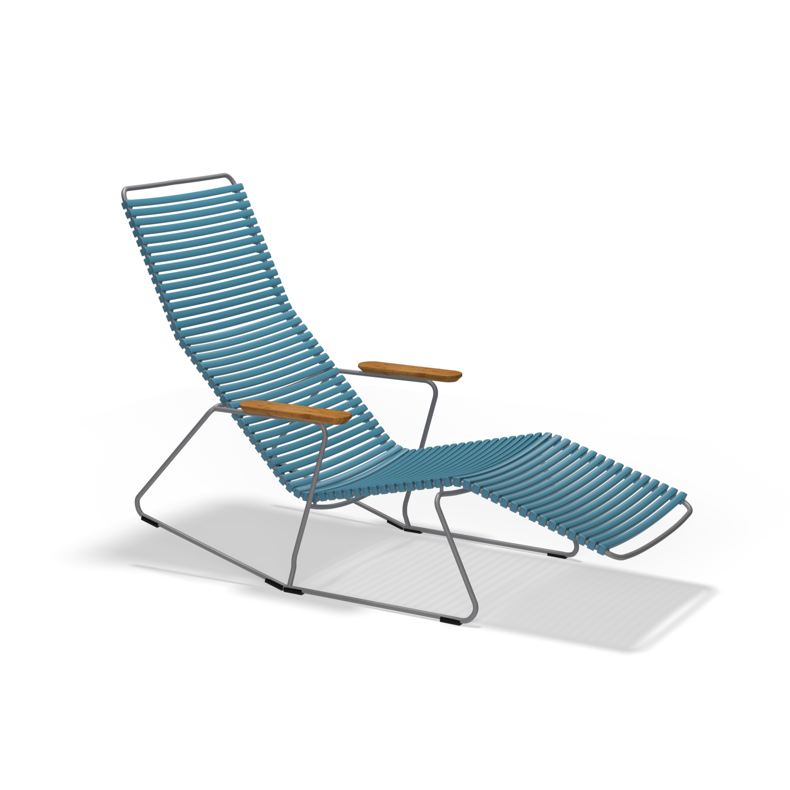 The Click Sunrocker by Houe is a modern lounge chair with a minimalist design, featuring a powder-coated steel frame and blue slatted seat. It includes armrests with wooden accents and an extended leg rest, making it stylish for outdoor relaxation.