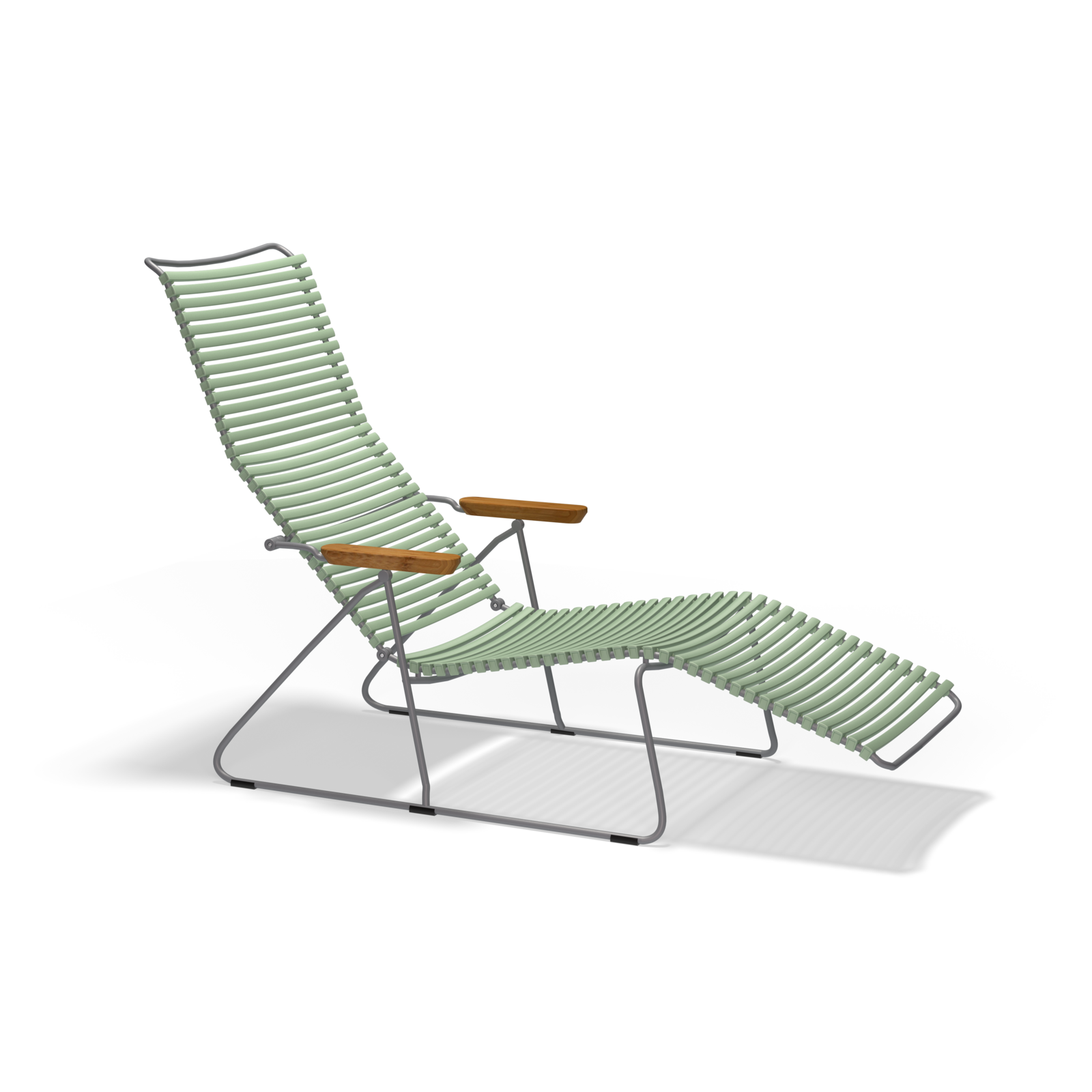 The Click Sunlounger by Houe is a modern, minimalist outdoor lounge chair with a metal frame and light green corded seat. It features UV-protected, cushion-free seating, wooden armrests, and a reclining footrest against a black backdrop.