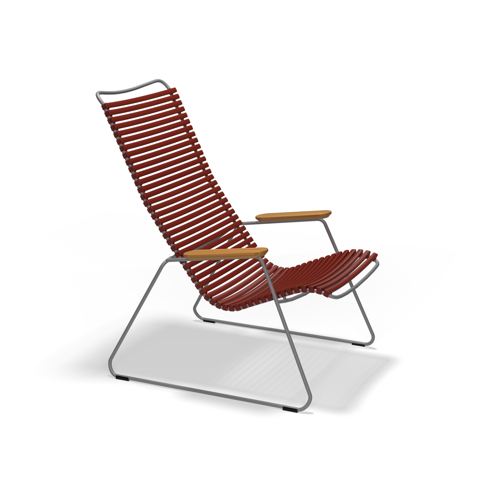 The Click Lounge Chair by Houe features a modern design with high backrest, red plastic lamellas, a sleek gray metal frame, and wooden armrests. Its minimalist and angular style is perfect for outdoor settings against a plain black background.