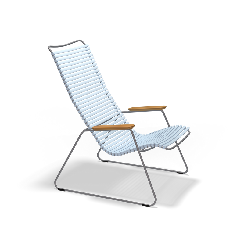 The Click Lounge Chair by Houe features a modern metal frame, a high backrest with horizontal white slats, wooden armrests, and a weather-resistant finish. Its minimalist design is perfect for outdoor settings against a black background.