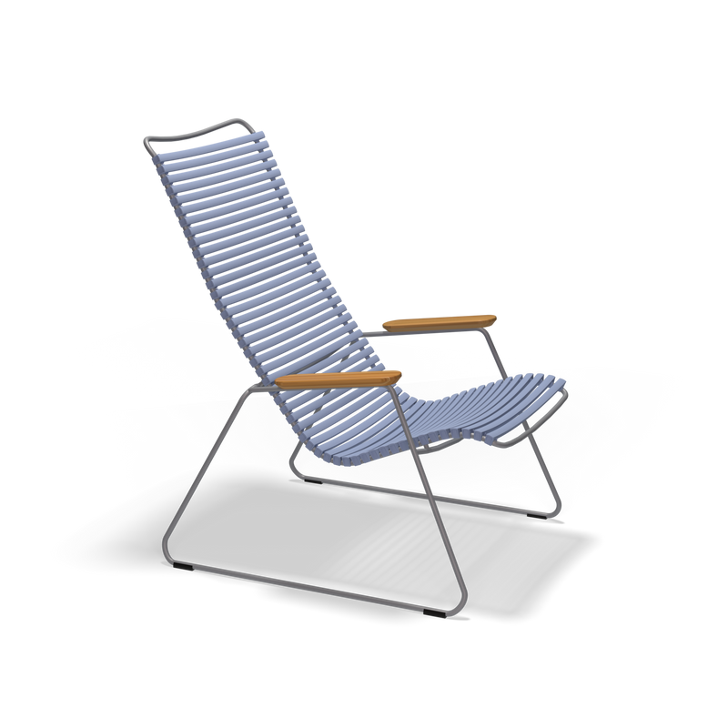 The Click Lounge Chair by Houe is a modern chair featuring light blue slats for the seat and backrest, metal legs, and bamboo wooden armrests. Its sleek design and weather-resistant build make it ideal for outdoor settings.