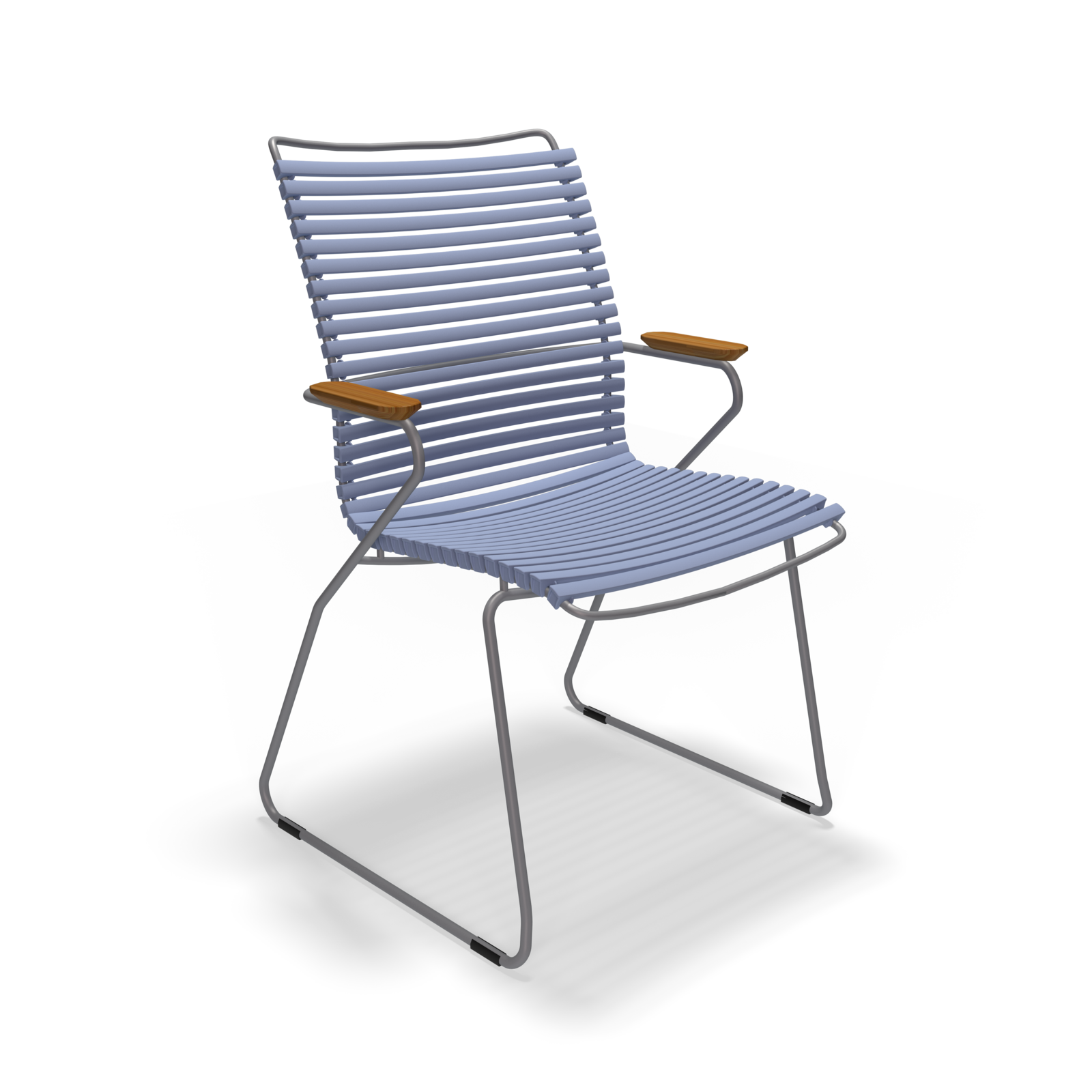 The Click Dining Chair with Armrest - Tall Back by Houe is a modern, minimalist outdoor chair featuring a curved, slatted blue seat and backrest made from UV-protected, weather-resistant material, slender metal legs, wooden armrests, and set against a black background.