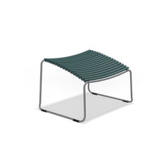 Introducing the Click Footrest by Houe, a modern minimalist stool with a UV-protected metal frame and curved green slatted seat. Its sleek design features slightly arched plastic lamellas, making it an ideal companion for outdoor chairs.