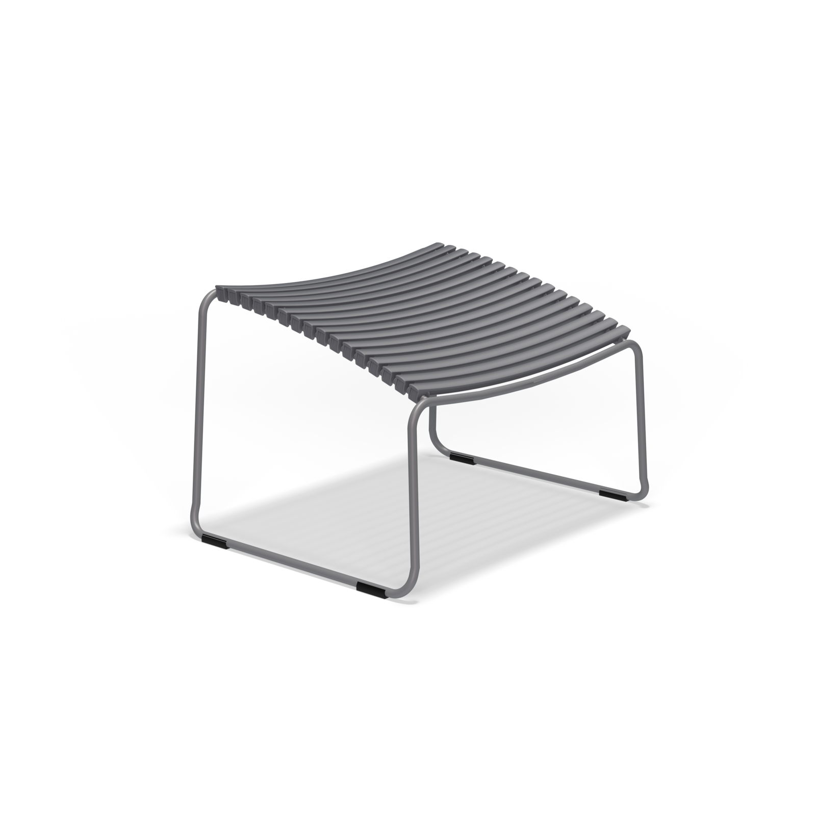 The Click Footrest by Houe is a minimalist gray metal stool featuring a curved ribbed seat, sled-style legs, and UV-protected materials for enhanced durability, set against a plain black background.