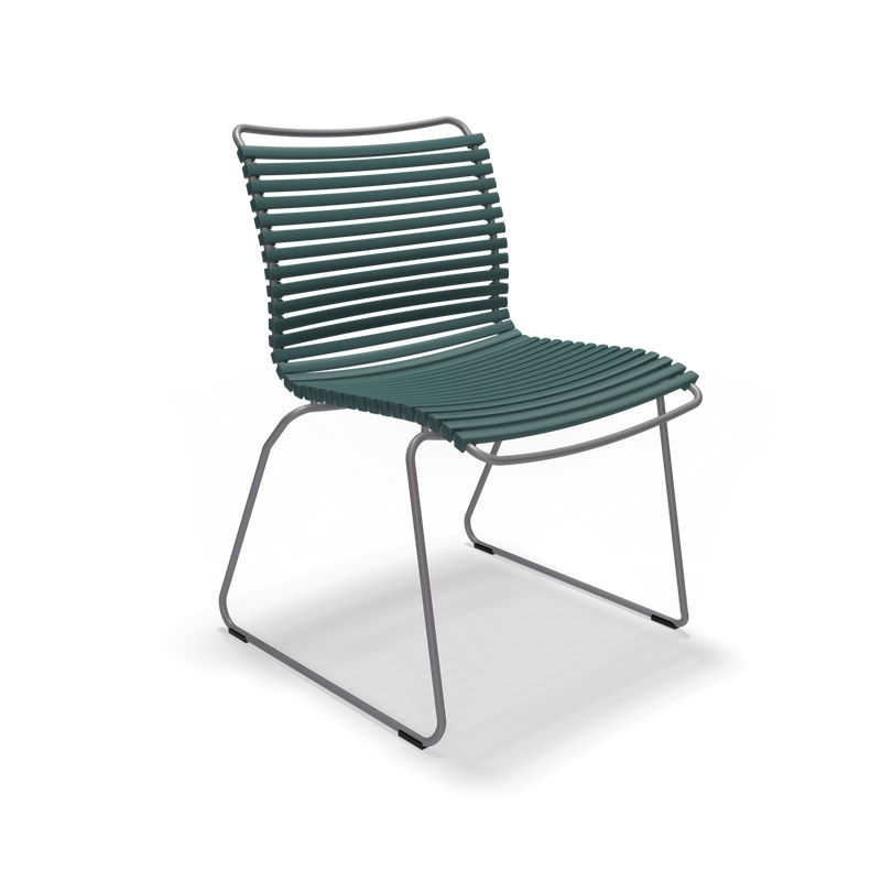 The Click Dining Chair without Armrest by Houe is a modern piece with a sleek, minimalist design. It has weather-resistant dark green plastic lamellas for the seat and backrest, supported by a thin metal base with angled legs. This airy contemporary style is perfect for outdoor settings.