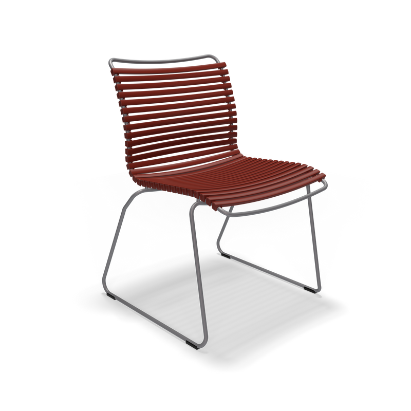 The Click Dining Chair without Armrest by Houe is a modern outdoor chair featuring sleek, minimalist design with a weather-resistant reddish plastic lamella seat, supported by a metal frame with sled-style legs. Set against a black background, it exudes stylish elegance.