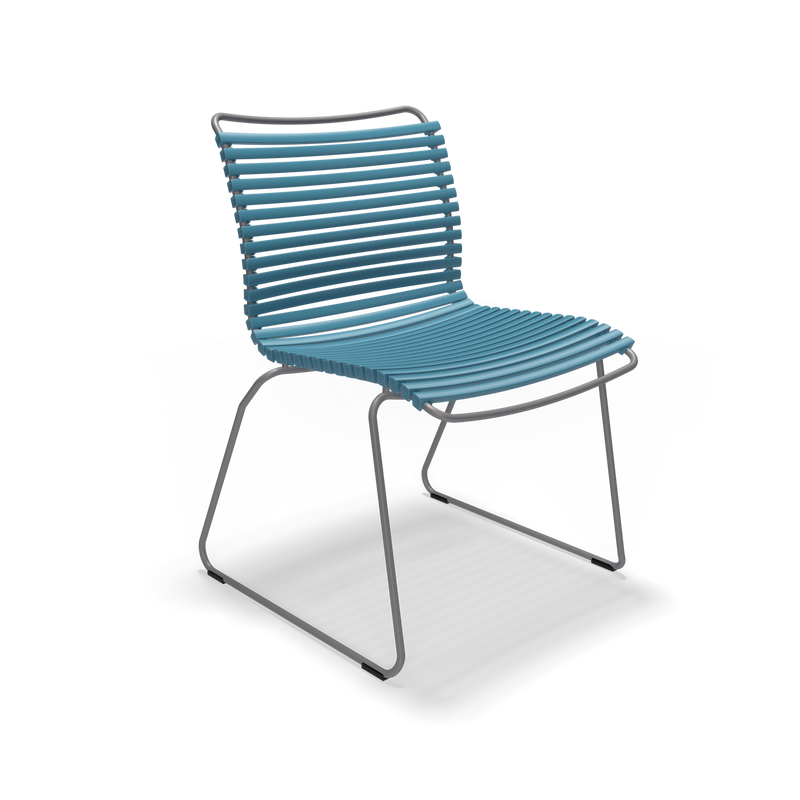 The Click Dining Chair by Houe flaunts a sleek, modern design featuring weather-resistant blue slats for the seat and backrest. It boasts a minimalist metal frame with angled legs and no armrests, all against a plain black background.