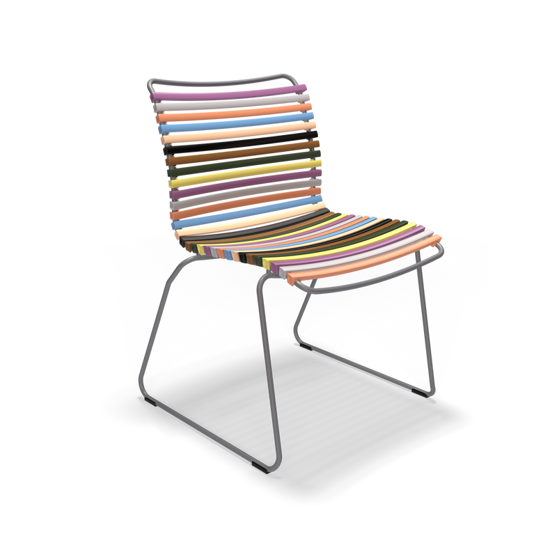 The Click Dining Chair without Armrest by Houe is a modern outdoor chair with weather-resistant plastic lamellas in vibrant shades like pink, blue, orange, and green. Its sleek black metal frame with angled legs highlights its lively palette on a black background.