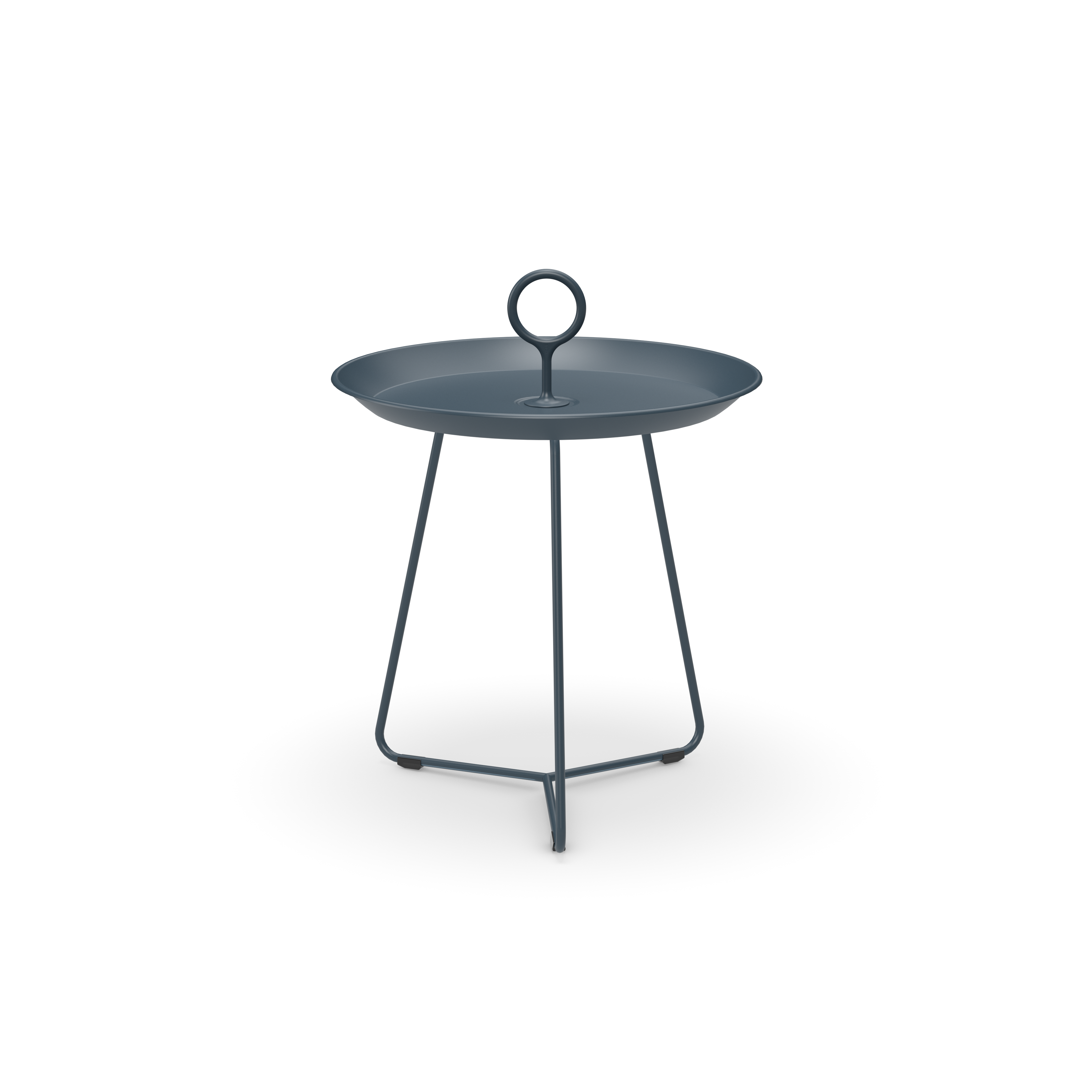 The Eyelet Tray Table by Houe is a small, round, dark blue piece with a tray-like top and central circular handle. Crafted from powder-coated steel, it features three thin metal legs that meet at the floor, embodying a minimalist and modern design.
