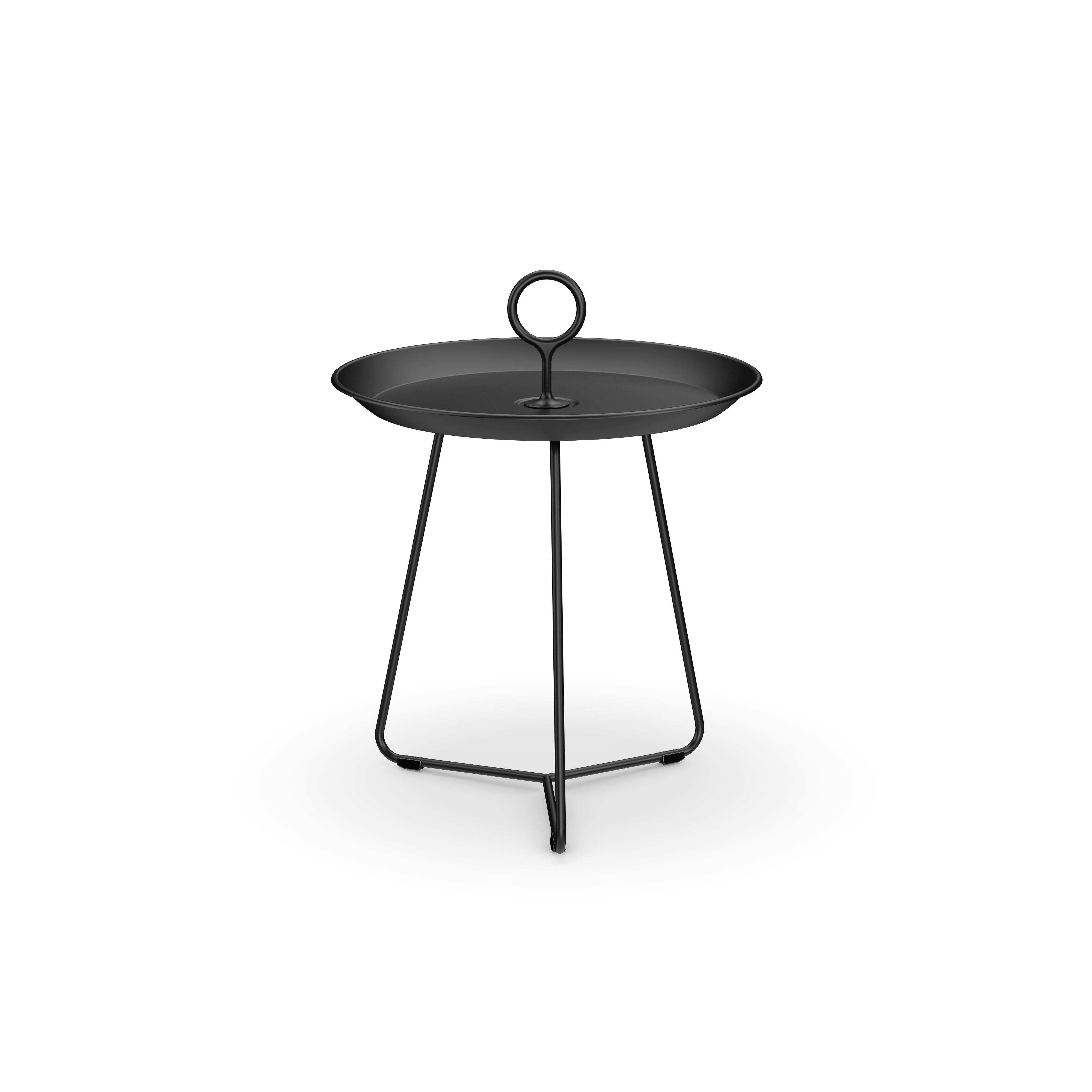 The Houe Eyelet Tray Table is a compact black metal side table made of powder-coated steel, featuring a round tray top with a loop handle. It stands on three slender legs connected by a triangular base support.