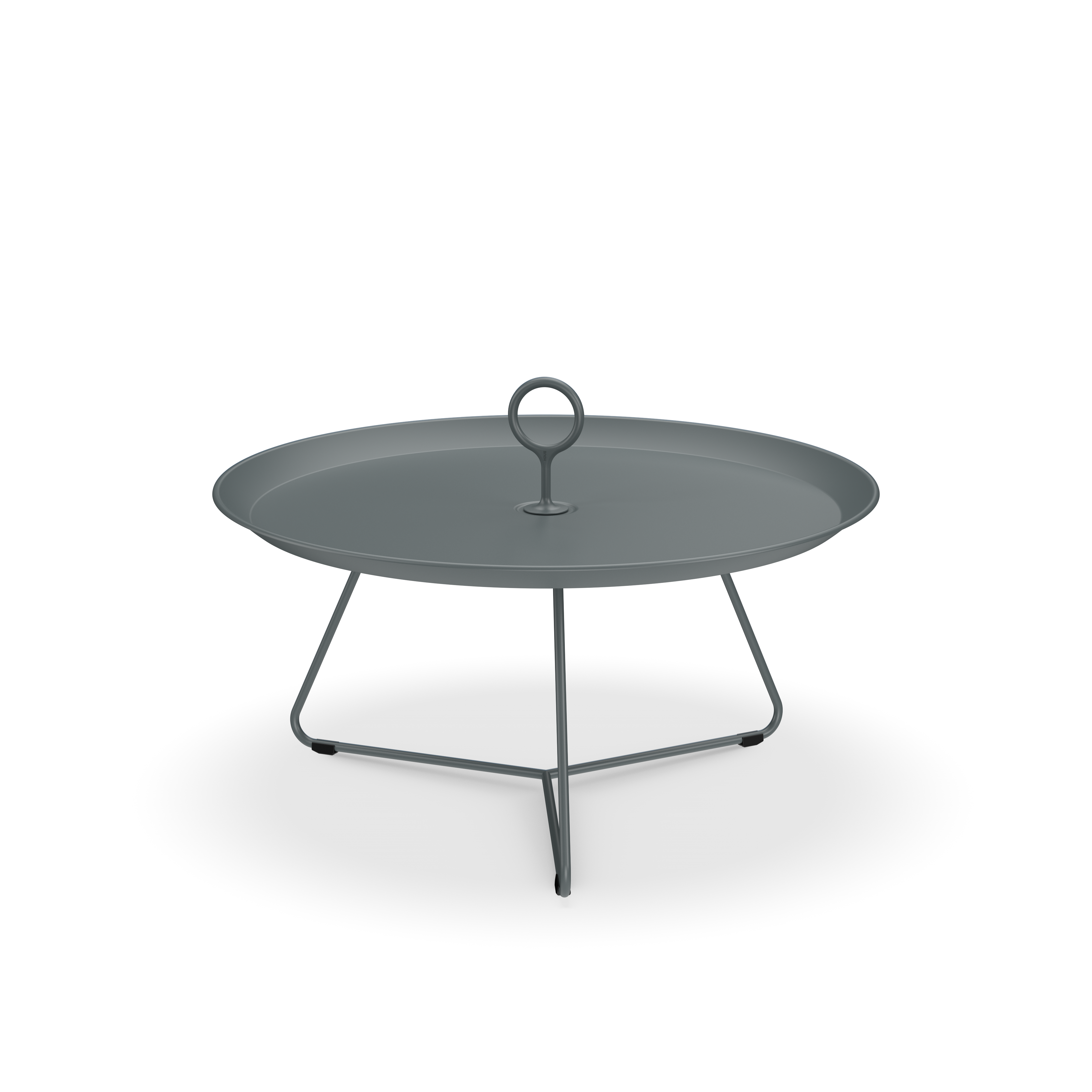 The Eyelet Tray Table by Houe features a round, gray tray made of powder-coated steel with a raised edge and central handle on a tripod stand. With its modern, minimalist design, its ideal for serving or decoration against the plain black background.