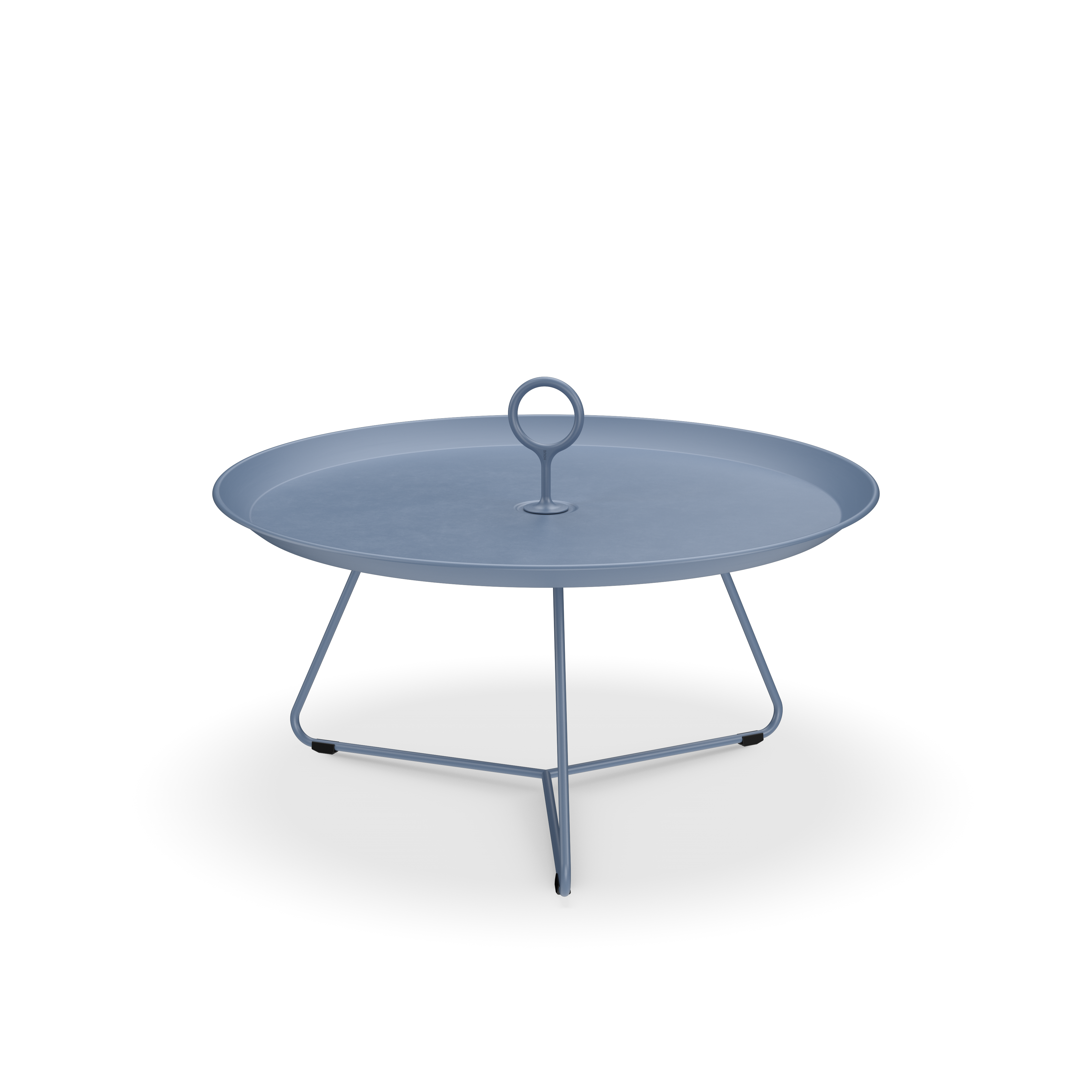 The Eyelet Tray Table by Houe is a round, blue side table crafted from powder-coated steel. It features a flat surface with a central loop handle and is supported by a minimalist three-legged frame, offering a simple, modern design.
