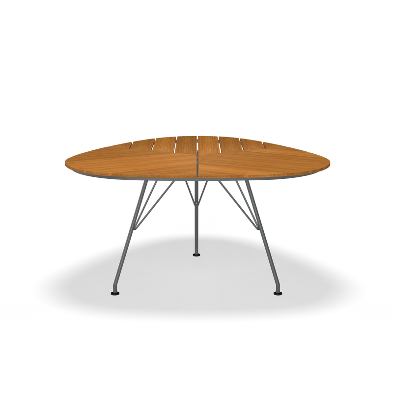 The Leaf Table by Houe, featuring a round wooden segmented top and sleek powder-coated steel legs, is showcased from the front against a black background.