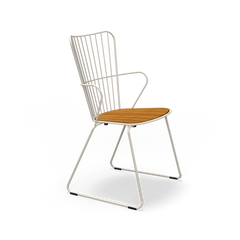 Experience Scandinavian design with the Paon Dining Chair by Houe. Its minimalist white metal frame and arms, high back with vertical slats, and wooden seat embody simplicity. Set against a black background, this piece echoes timeless elegance in modern style.