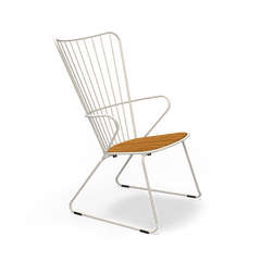 The Houe Paon Lounge Chair features a sleek design with a white powder-coated steel frame and wooden seat. Its back has vertical metal rods, and the legs form a continuous loop for a minimalist style.