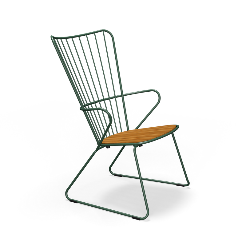 The Paon Lounge Chair by Houe features a black wireframe backrest and armrests, bamboo lamellas for the seat, and angled powder-coated steel legs that blend minimalism with elegance.