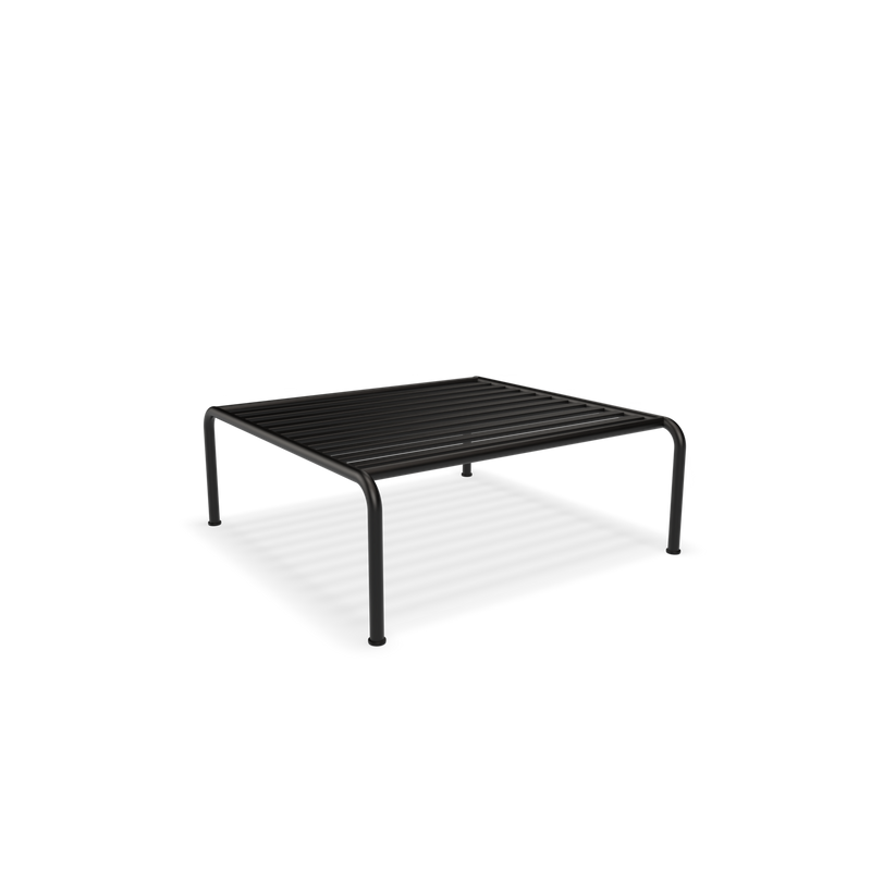 Part of the Houe collection, the Avon Ottoman features a simple, minimalist design. With its rectangular shape and grid-like base supported by four sturdy legs, it stands gracefully against a plain black background.