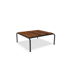 The Houe Avon Coffee Table boasts a wooden slat top and minimalist black metal legs, ideal for any lounge with its plain white backdrop.