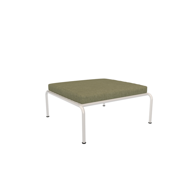 From the Houe Avon collection, this minimalist ottoman boasts a dark green cushion and sleek metal legs, all set against a simple black backdrop.