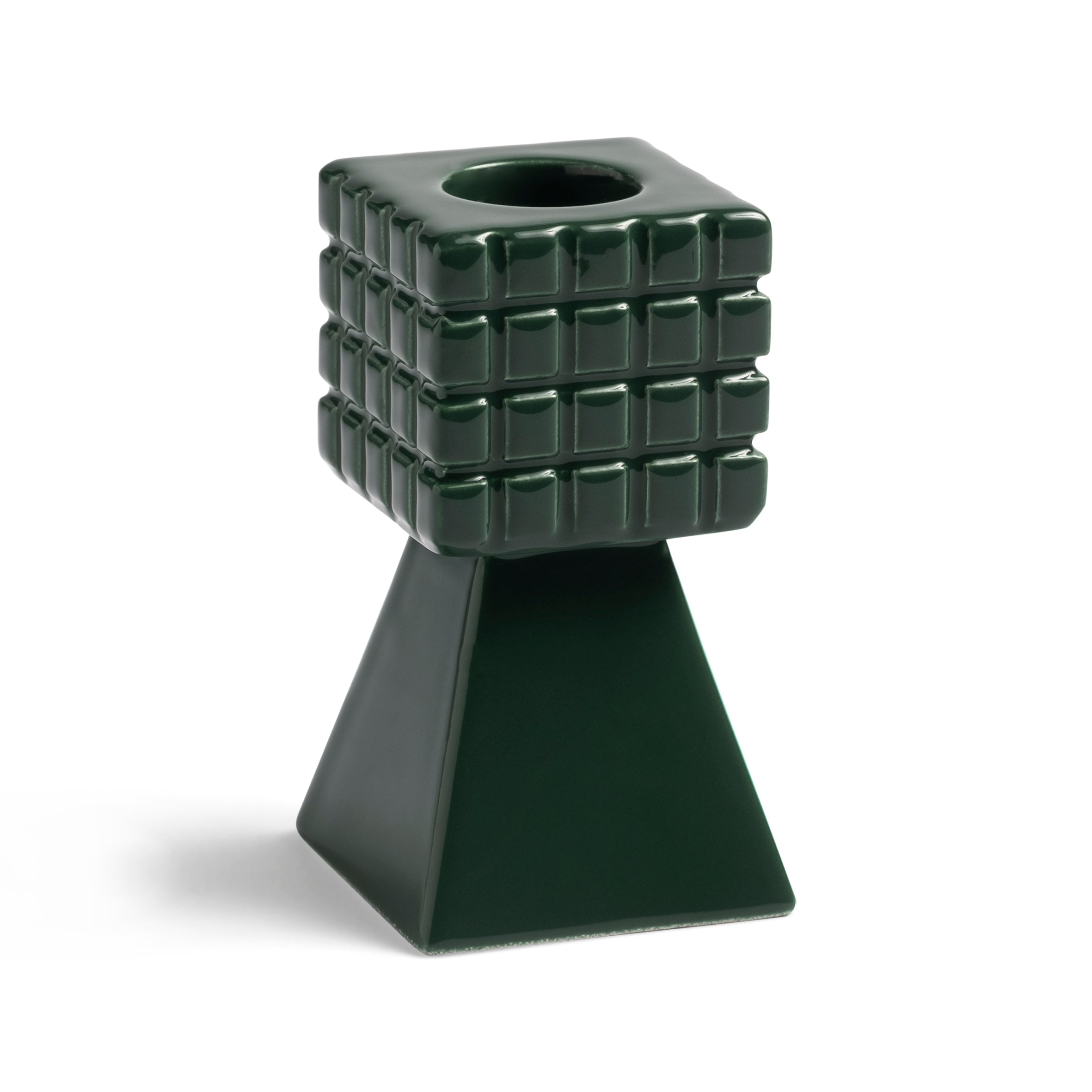 The Candle Holder Stack Green by &Klevering features a retro-colored green ceramic design with a square grid pattern on top and a solid pyramid-shaped base, making it an eye-catching piece.
