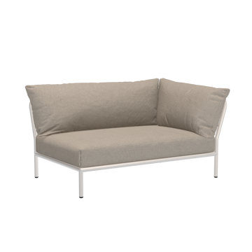 The Houe Level Corner Sofa is a modern beige outdoor sectional with a powder-coated aluminum frame and plush Sunbrella cushions, designed for corner placement against a black background, offering style and durability.