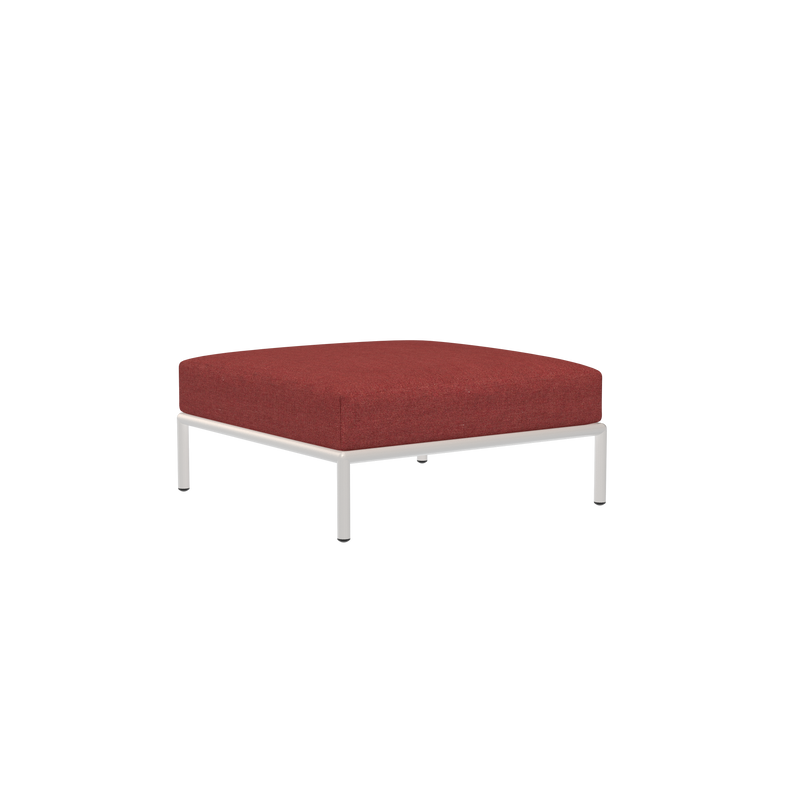 The Level Ottoman by Houe is a minimalist design featuring a dark red square cushion on a sleek metal frame crafted from powder-coated aluminum, set against a black background.