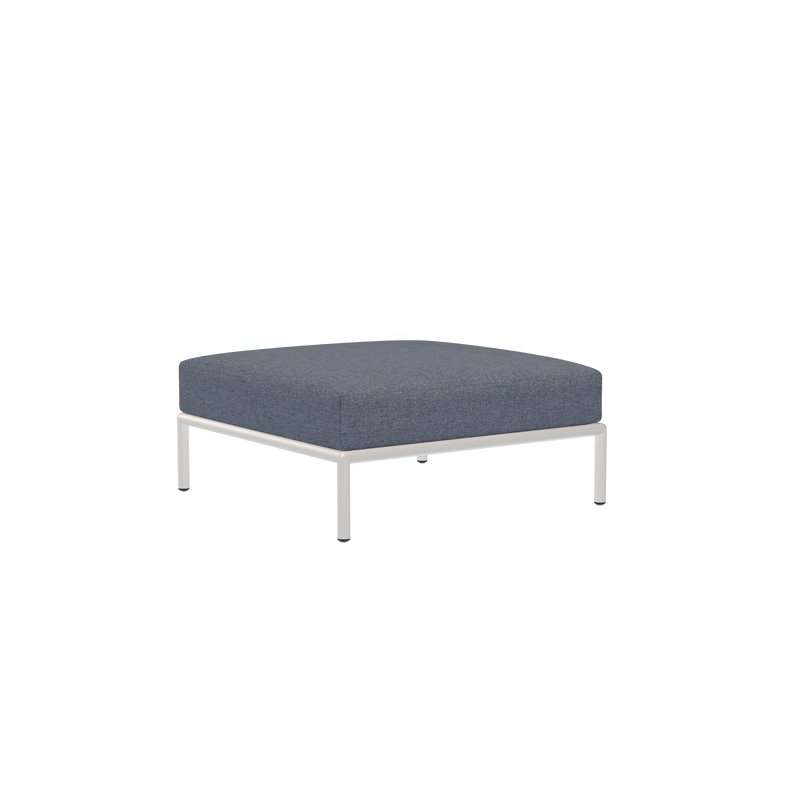 The Level Ottoman by Houe is a minimalist, dark gray, square piece featuring water-repellent fabric and a simple silver metal frame, showcased against a plain black background.