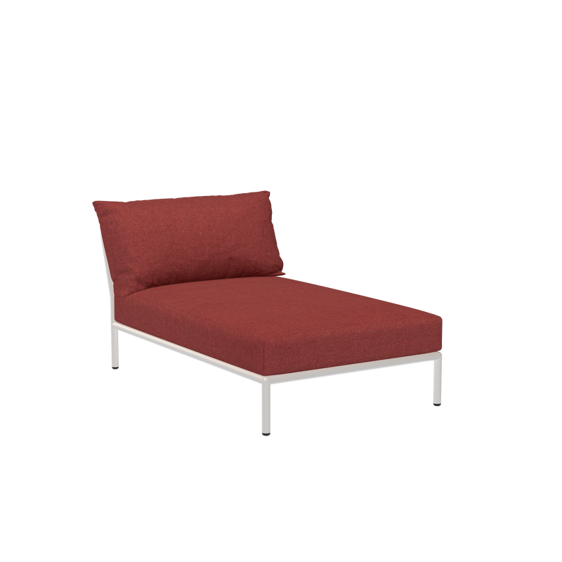 The Level Chaiselongue by Houe features a modern red design with a silver metal frame, set against a black background. Made from durable Sunbrella fabric, it offers a cushioned seat and backrest for enhanced comfort, combining both style and practicality.