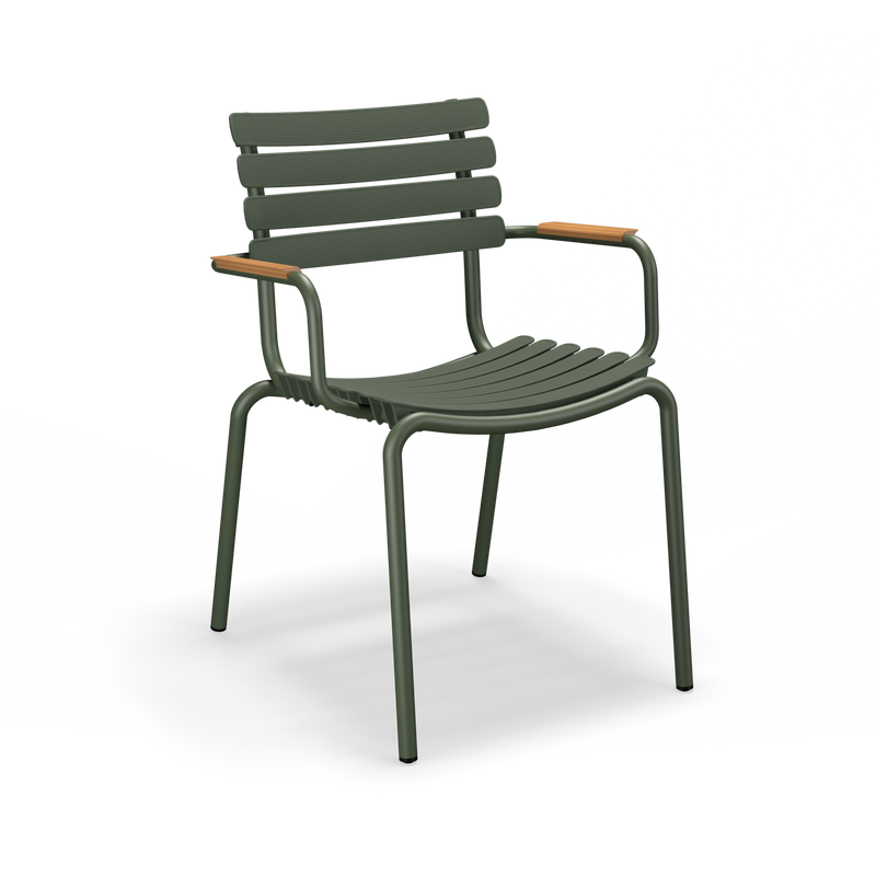 The ReClips Dining Chair by Houe combines Danish design and innovation with green metal, featuring curved slats for the seat and backrest. It stands on four legs, has bamboo armrests, and offers a modern look against a solid black background, highlighting ReCLIPS plastic lamellas.