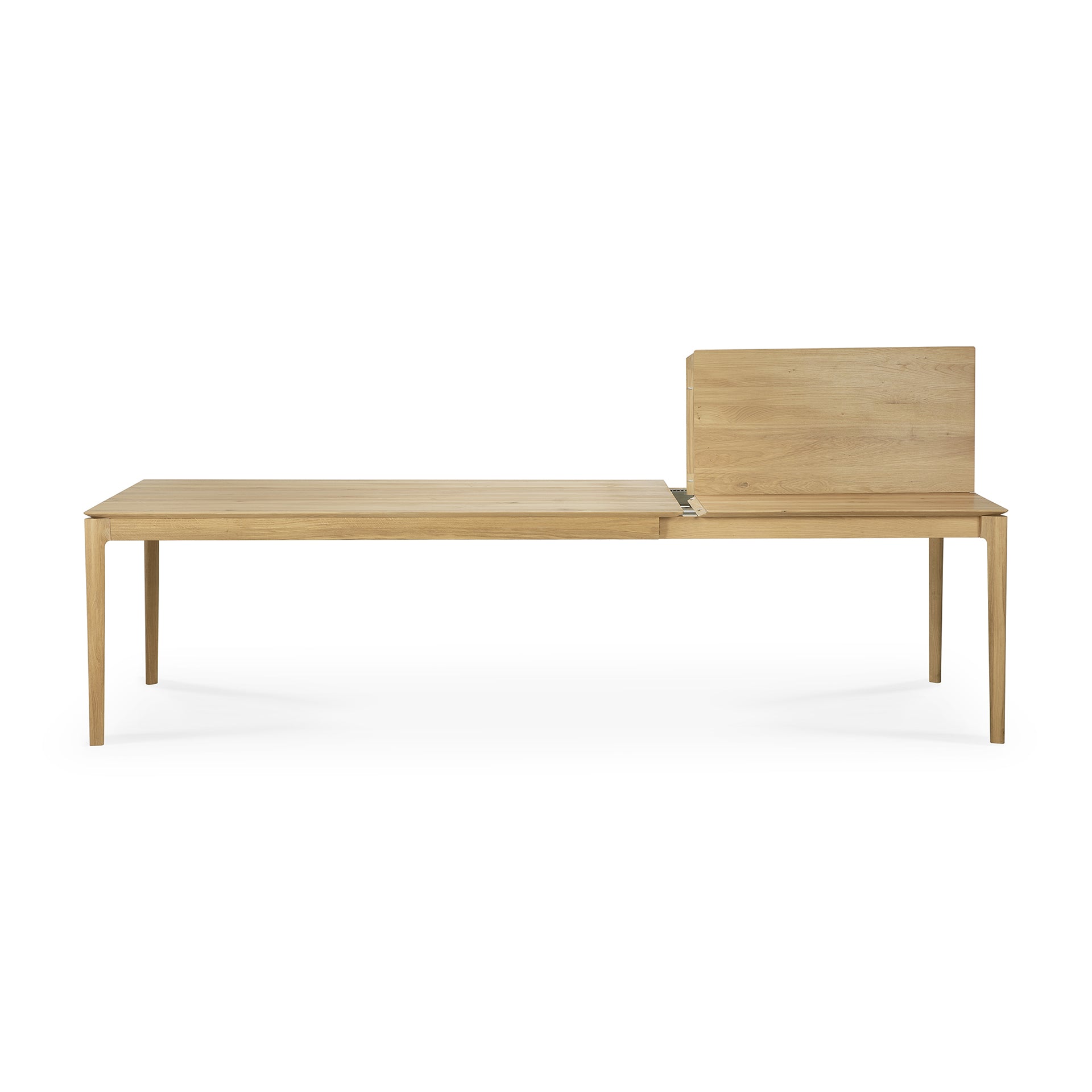 The Ethnicraft Bok Extendable Dining Table features a contemporary rectangular light wood design with slender legs and an upright wooden partition at one end, displayed against a white background.