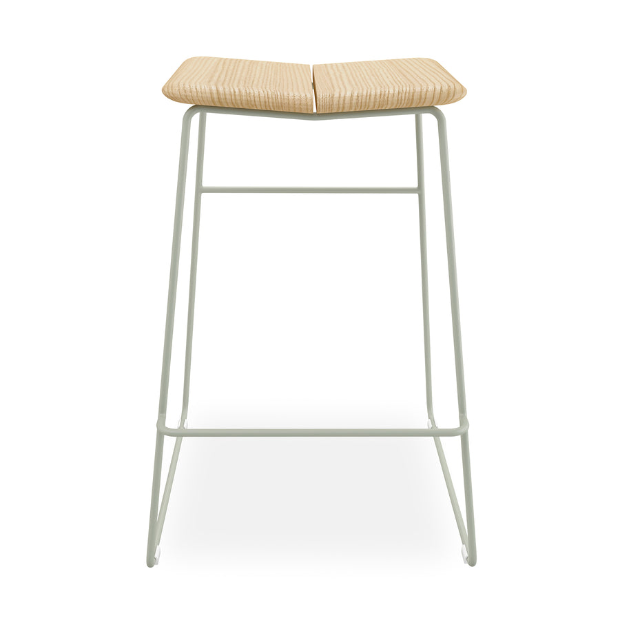 The Gus Modern Aero Bar Stool features a light solid Ash wood seat with a central groove and a minimal white metal frame, highlighting Scandinavian design on a plain white background.