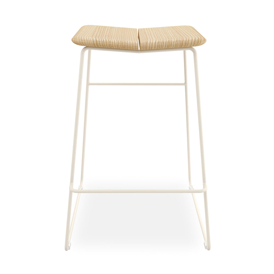 The Gus Modern Aero Bar Stool showcases a contoured solid Ash wood seat and a white metal frame with footrest, combining minimalist contemporary style with Scandinavian design.