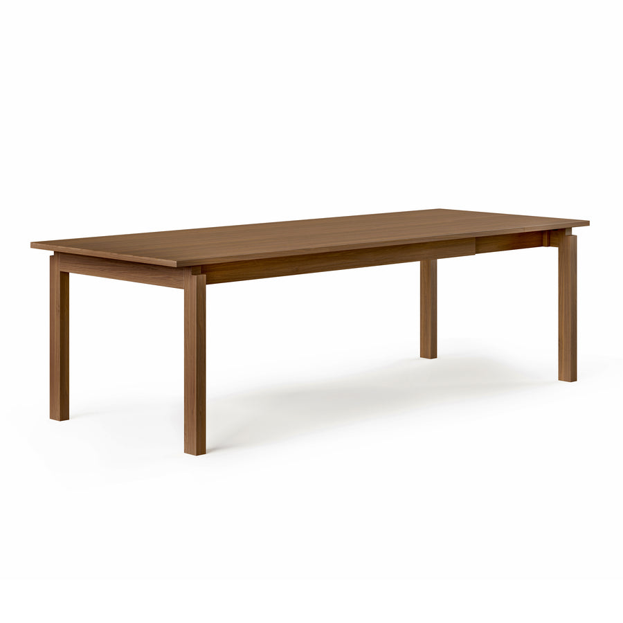 The Gus Modern Annex Extendable Dining Table is a rectangular wooden table with a smooth surface and four straight legs, shown against a plain white background.