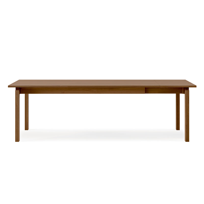 The Gus Modern Annex Extendable Dining Table features a rectangular wooden top with four straight legs, displayed against a plain white background.