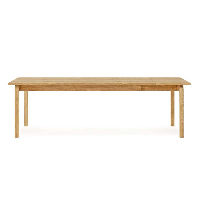 The Gus Modern Annex Extendable Dining Table is a rectangular wooden table with four straight legs and a smooth surface, shown against a white background.
