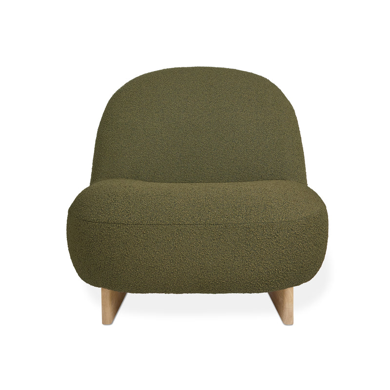 The Arlo Chair by Gus Modern features an olive green, rounded back and seat in textured bouclé fabric with short, angled wooden legs—an ideal way to bring Scandinavian design flair to any lounge.