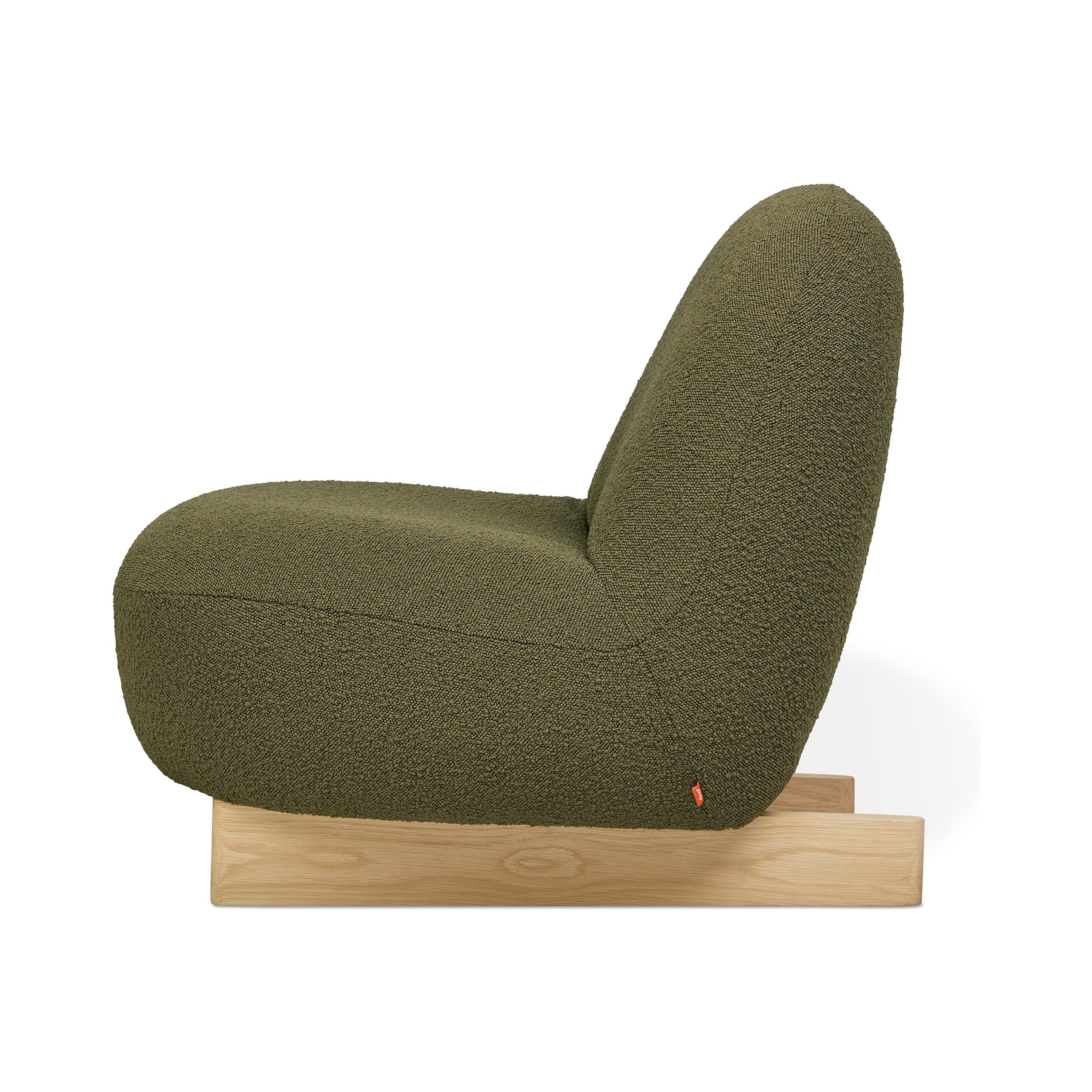 Side view of the Gus Modern Arlo Chair, showcasing olive green bouclé fabric and a simple light wood base in true Scandinavian style, set against a white background.