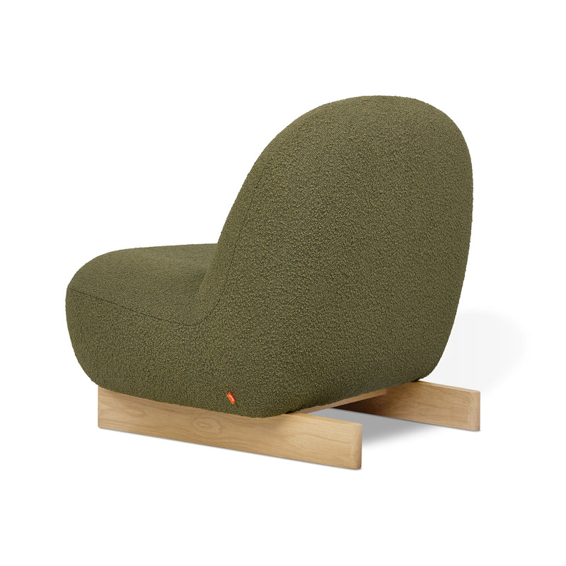 The Gus Modern Arlo Chair features olive green bouclé fabric, a rounded back and seat, plus light wood sled legs—Scandinavian-inspired style displayed on a white background.